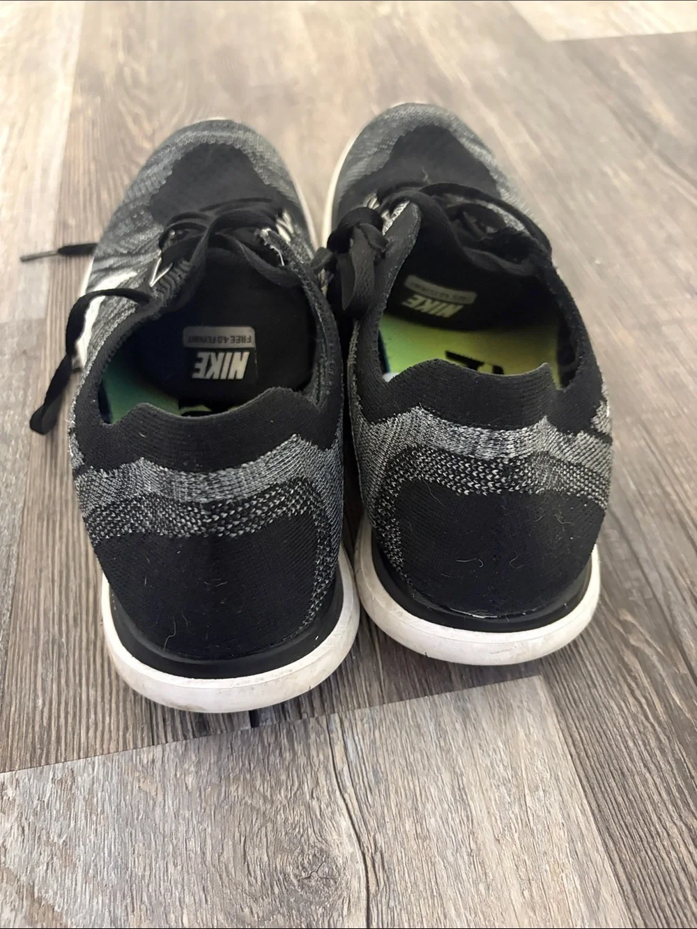 Nike Men’s Black and White Flyknit Athletic Sneakers